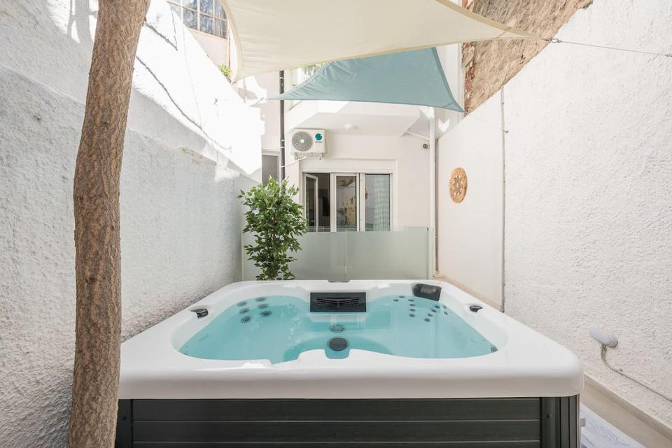 Hostaway customer WelcomeHost is Athens' leading short term and vacation rental company. This image shows an outdoor hot tub at one of their properties. Learn why they made the switch from Guesty to Hostaway. 
