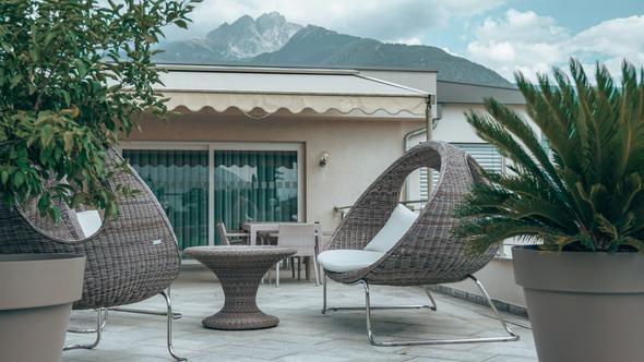 An inviting outdoor living space at a short-term rental property, the kind of amenity detail that signals listing quality to Google and helps property managers stand out in metasearch results.