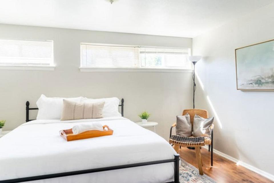 Hostaway customer Midtown Stays offers the traveler and business person alike great accommodations in the heart of the city. This is an image of a bed from one of their short term rental properties