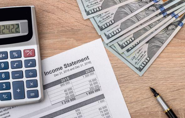 Manually creating an Owner-Ready Financial Statement with spreadsheets and a calculator.
