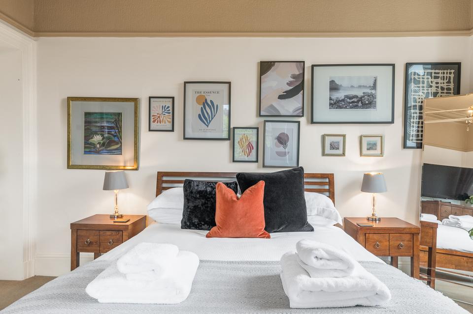 A bedroom from one of the Brathay Cottages properties. Elegantly designed to make guests feel welcome.